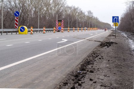 Photo for Beware, detour, repair of the road. Change lanes - Royalty Free Image