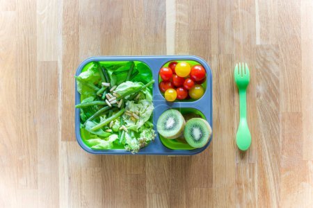 Photo for "Foldable Lunch Box with healthy food" - Royalty Free Image
