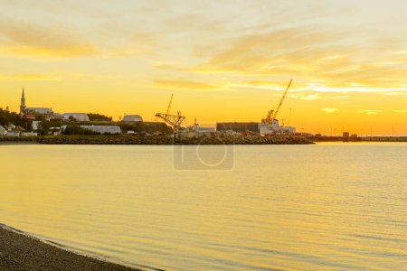 Photo for Sunset view of the shipyards and the village, in Les Mechins - Royalty Free Image