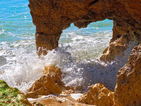 Photo for Red cliffs in blue ocean at coast of Albufeira in Portugal - Royalty Free Image