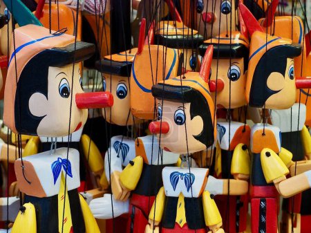 Photo for Many wooden Pinocchio puppets at a market - Royalty Free Image
