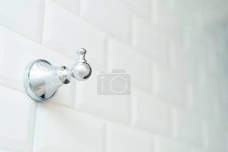 Photo for Towel metal hook on the white brick wall. - Royalty Free Image