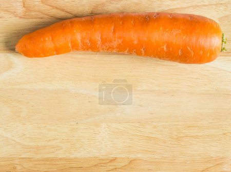 Photo for Carrot on wooden background - Royalty Free Image