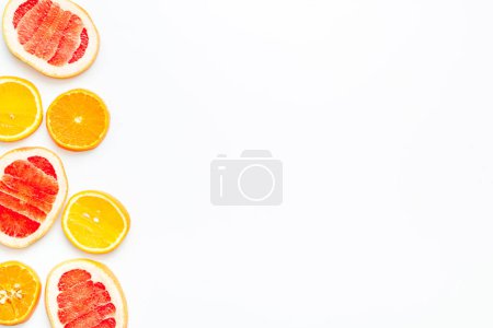 Photo for Grapefruit and orange slices top view, copy space - Royalty Free Image