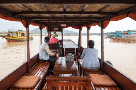 Photo for Lady on private cruise, Tonle Sap, Cambodia, Asia - Royalty Free Image