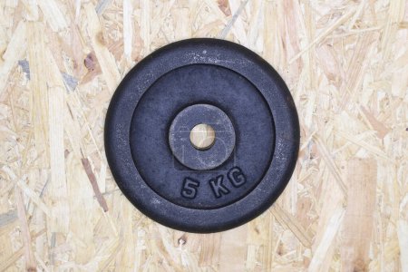 Photo for 5 kilo weight plate on background, close up - Royalty Free Image