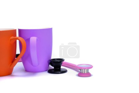 Photo for Stethoscopes and coffee mugs on background, close up - Royalty Free Image