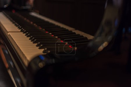 Photo for Piano keys on black classical grand piano - Royalty Free Image
