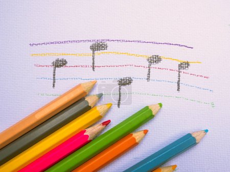 Photo for "Color pencils place on white paper background with Music note drawing. Education concept." - Royalty Free Image