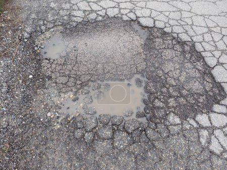 Photo for Pothole in road, close up - Royalty Free Image