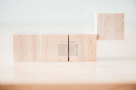 Photo for "row of wood cube building block on wooden table" - Royalty Free Image