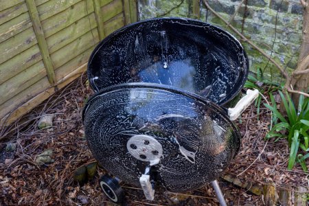 Photo for Cleaning a Kettle Drum BBQ - Royalty Free Image