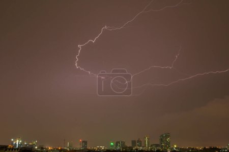 Photo for Thunder on rain cloudy sky with city view - Royalty Free Image