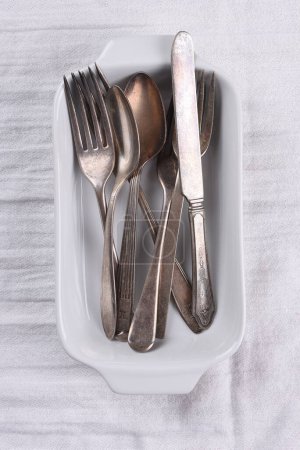 Photo for Empty silver cutlery set on grey background. - Royalty Free Image