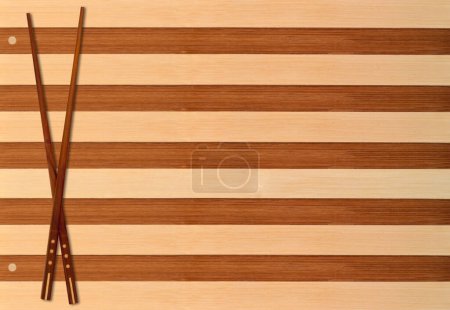 Photo for Traditional japanese bamboo chopsticks on wooden background. - Royalty Free Image