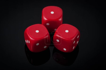 Photo for Red dices on black background - Royalty Free Image