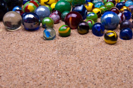 Photo for Colorful marbles balls on sand - Royalty Free Image