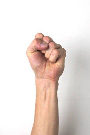 Foto de "A fist held up high. The universal symbol for resistance, uprising or protest." - Imagen libre de derechos