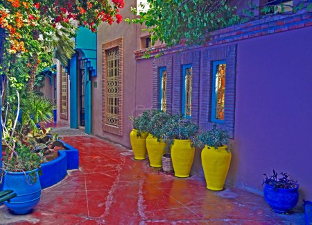 Photo for "A view of a Colourful terrace with yellow pottery containers in Marrakech" - Royalty Free Image