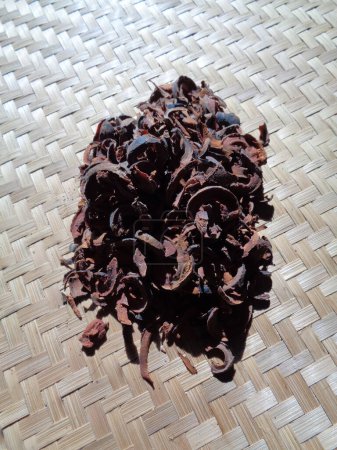 Photo for Dried mangosteen (Garcinia mangostana, purple mangosteen, manggis) peel. Mangosteen rind used as herbal medicine. - Royalty Free Image