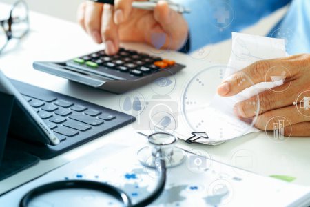 Photo for Healthcare costs and fees concept.Hand of smart doctor - Royalty Free Image