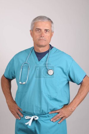 Photo for Doctor in Scrubs with Hands on Hips. Healthcare and medicine concept - Royalty Free Image
