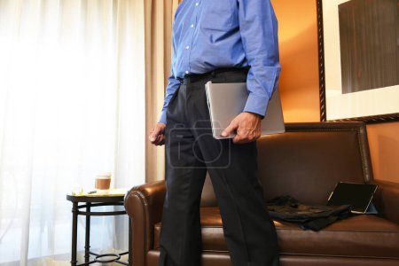 Photo for Businessman in Hotel Room - Royalty Free Image