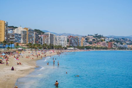 Photo for Holidaymakers sunbathing on Malagueta beach - Royalty Free Image