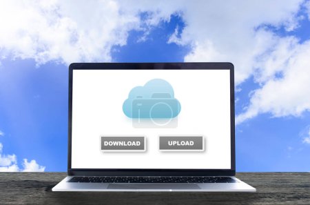 Photo for Laptop with cloud backup data screen on wooden table and blue - Royalty Free Image