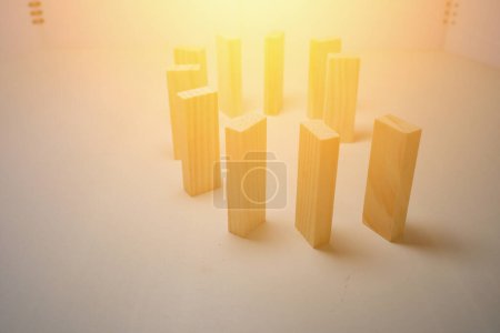 Photo pour "Blocs en bois, utilisés pour les jeux domino. Il y a la lumière du soleil au-dessus de la photo." - image libre de droit