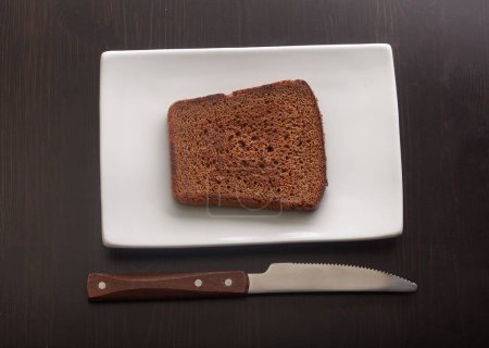 Photo for Toasted rye bread on the white plate - Royalty Free Image