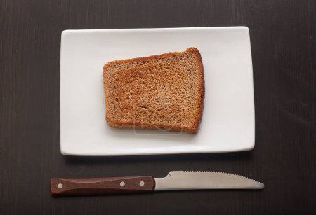 Photo for Toasted rye bread on the white plate - Royalty Free Image