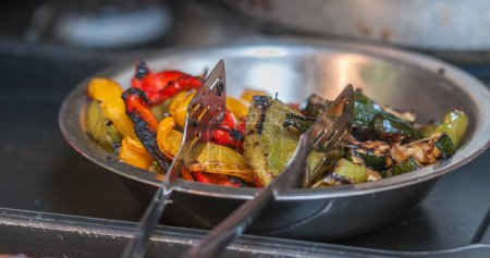 Photo for Metal dish of cooked peppers - Royalty Free Image