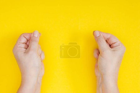 Photo for Hands with clenched fingers in a pinch - Royalty Free Image