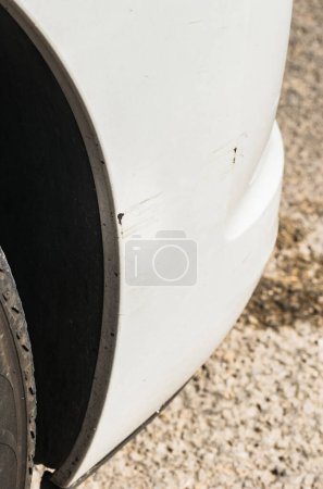 Photo for "Car accident with scratched car bumper and fender" - Royalty Free Image