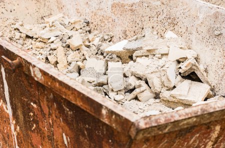 Photo for "Heap of building rubble in rubbish container" - Royalty Free Image