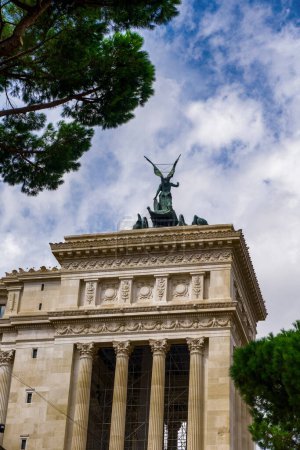 Photo for "Rome, Italy winged statue of goddess Victoria on top of Altare della Patria monument." - Royalty Free Image
