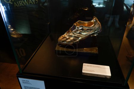 Photo for Lionel Messi 2012-2013 gold shoe replica inside FC Barcelona Museum - Royalty Free Image