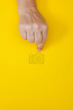 Photo for Hand with clenched fingers in a pinch - Royalty Free Image