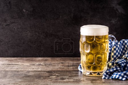 Photo for Oktoberfest beer on wooden table - Royalty Free Image