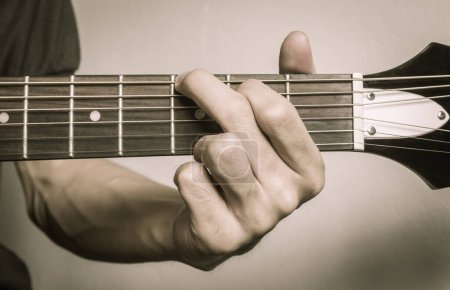 Photo for Guitar Player Hand in G Major Chord on Acoustic Guitar in Front - Royalty Free Image