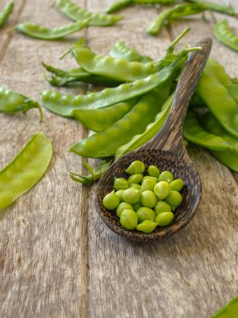Photo for Peas on the wooden background - Royalty Free Image
