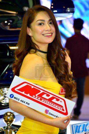 Photo for MCC 4x4 accessories female model at Manila Auto Salon car show - Royalty Free Image