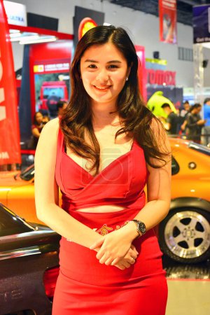 Photo for "Car show female model at Trans Sport Show in Pasay, Philippines - Royalty Free Image
