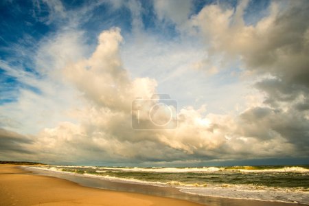 Photo for "lonesome beach of the Baltic Sea with cloudy sky - Royalty Free Image