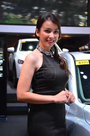 Téléchargez les photos : "Mazda modèle féminin au Salon international de l'automobile des Philippines - en image libre de droit