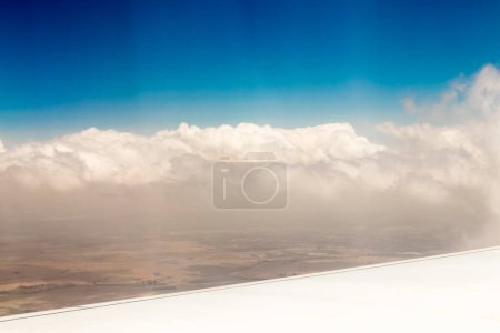 Photo for View from airplane window at high altitude, turbines about Africa. - Royalty Free Image