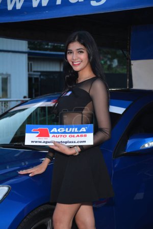 Photo for Aguila auto glass female model at Makina Moto show in Pasay - Royalty Free Image