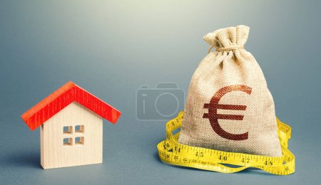 Photo for House and a euro money bag. Property real estate valuation. Buying and selling, fair price. Building maintenance. Mortgage loan. Calculation of expenses for purchase, construction and repair. - Royalty Free Image