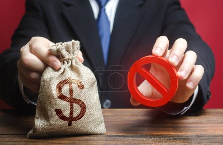 Photo for Businessman refuses to give a money bag. Denial of cooperation. Refusal to grant loan mortgage, bad credit history. Economic sanctions, confiscation funds, deductions and fines. Financial difficulties - Royalty Free Image